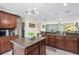 Beautiful kitchen with hardwood floors, granite countertops and large island, perfect for entertaining at 171 Mcleods Way, Winter Springs, FL 32708