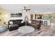 Spacious living room with hardwood floors that opens to kitchen, complete with a ceiling fan at 171 Mcleods Way, Winter Springs, FL 32708