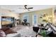 Inviting living room features hardwood floors, neutral green paint, and access to the patio at 171 Mcleods Way, Winter Springs, FL 32708