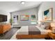 Bright bedroom features a modern style, high ceilings, contemporary decor, and windows offering a view of the pool at 17505 Silver Creek Ct, Clermont, FL 34714