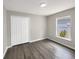 This bedroom has waterproof vinyl flooring and a window letting in natural light at 17505 Silver Creek Ct, Clermont, FL 34714