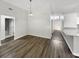 View of dining room featuring waterproof vinyl flooring, neutral paint, and modern pendant lighting at 17505 Silver Creek Ct, Clermont, FL 34714