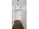 Welcoming entryway featuring wood-look floors and a stylish light fixture, setting a modern tone at 17505 Silver Creek Ct, Clermont, FL 34714
