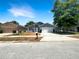 Charming single-Gathering home featuring a well-maintained lawn, attached two-car garage, and freshly painted gray exterior at 17505 Silver Creek Ct, Clermont, FL 34714