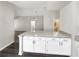 The bright kitchen island boasts modern cabinets and counter tops at 17505 Silver Creek Ct, Clermont, FL 34714