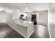 Modern kitchen featuring granite countertops, stainless steel appliances, and ample natural light at 17505 Silver Creek Ct, Clermont, FL 34714