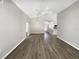Spacious living room featuring modern flooring, neutral colors, and an open floorplan with view to kitchen at 17505 Silver Creek Ct, Clermont, FL 34714