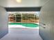 Inviting screened-in pool area with refreshing water and a view of the landscaped backyard at 17505 Silver Creek Ct, Clermont, FL 34714