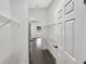 Bright and airy walk-in closet with vinyl flooring and installed shelving with multiple access points at 17505 Silver Creek Ct, Clermont, FL 34714