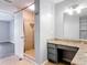 Elegant bathroom with a walk-in shower, granite countertops and vanity space at 185 Poinciana Ln, Deltona, FL 32738