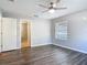 Bright bedroom with a ceiling fan and a door leading to a walk-in closet at 185 Poinciana Ln, Deltona, FL 32738