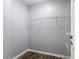 Walk-in closet with rod and shelving for easy and stylish storage at 185 Poinciana Ln, Deltona, FL 32738