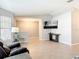 Open living room with tile floors, neutral paint, and a large window that allows plenty of natural light at 185 Poinciana Ln, Deltona, FL 32738