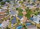 Aerial view of a neighborhood showcasing well-maintained homes and mature trees at 1862 Spreakley Ct, Orlando, FL 32837