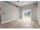 Bright, airy bedroom with clean walls, minimalist trim and a sliding glass door at 1862 Spreakley Ct, Orlando, FL 32837