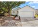 Charming single-Gathering home featuring a manicured lawn and a two-car garage at 1862 Spreakley Ct, Orlando, FL 32837