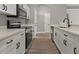 Modern kitchen features white cabinets, stainless steel appliances, and wood-look flooring at 1862 Spreakley Ct, Orlando, FL 32837
