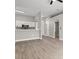 Open-concept living area with a kitchen featuring white cabinets and modern finishes with grey walls at 1862 Spreakley Ct, Orlando, FL 32837