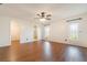 Bright bedroom with hardwood floors, ceiling fan, closet, and bathroom access, offering a comfortable layout at 21529 Prince Albert Ct, Leesburg, FL 34748