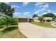 Charming single-story home featuring a well-maintained lawn and a two-car garage at 21529 Prince Albert Ct, Leesburg, FL 34748