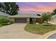 Charming single-story home featuring a well-maintained lawn and a two-car garage at 21529 Prince Albert Ct, Leesburg, FL 34748
