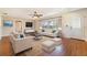 Bright living room with hardwood floors, modern furniture and natural light at 21529 Prince Albert Ct, Leesburg, FL 34748