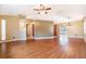 Expansive living room showcasing hardwood floors and an open-concept design at 21529 Prince Albert Ct, Leesburg, FL 34748