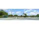Well-maintained tennis courts and outdoor seating areas at 21529 Prince Albert Ct, Leesburg, FL 34748