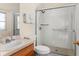 Accessible bathroom features a clear glass shower with a built-in seat at 235 Hollingshead Loop, Davenport, FL 33896