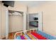 Bedroom with hardwood floors and a double closet at 235 Hollingshead Loop, Davenport, FL 33896