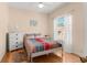 Bright bedroom featuring hardwood floors and natural light at 235 Hollingshead Loop, Davenport, FL 33896