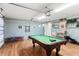 Spacious garage with a pool table, perfect for entertainment and recreation at 235 Hollingshead Loop, Davenport, FL 33896
