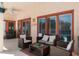 Covered lanai provides a comfortable outdoor seating area with view of the pool at 235 Hollingshead Loop, Davenport, FL 33896