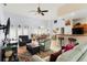 Inviting living room with open concept to dining and kitchen, featuring bright interiors at 235 Hollingshead Loop, Davenport, FL 33896