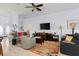 Open concept living room featuring a ceiling fan, neutral paint, and tile flooring at 235 Hollingshead Loop, Davenport, FL 33896