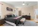 Main bedroom with ensuite bathroom, walk-in closet, and light wood floors at 235 Hollingshead Loop, Davenport, FL 33896
