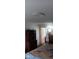 Bedroom featuring wooden cabinet with decor and doorway to bathroom at 25618 Fishermans Rd, Paisley, FL 32767