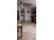 Well-lit kitchen with adjacent laundry area, featuring tile flooring and ample space at 25618 Fishermans Rd, Paisley, FL 32767