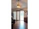 Bright living room features hardwood floors, ceiling fan, and sliding glass doors for natural light at 25618 Fishermans Rd, Paisley, FL 32767