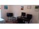 Well-lit office area with desk, computer, and decorative artwork at 25618 Fishermans Rd, Paisley, FL 32767