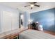 This light-filled bedroom includes a ceiling fan, closet and a work desk space at 2935 Arcata Ln, Orlando, FL 32817