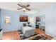 Bedroom featuring closet with mirrored doors, a cityscape picture and wood flooring at 2935 Arcata Ln, Orlando, FL 32817