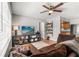 Open living area with tile floors, ceiling fan and access to the kitchen at 2935 Arcata Ln, Orlando, FL 32817