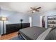 Comfortable bedroom with wood floors, ceiling fan, and a spacious closet at 2935 Arcata Ln, Orlando, FL 32817