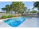 Refreshing pool with a privacy fence and lush landscaping at 307 Coble Dr, Longwood, FL 32779
