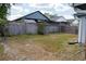 Fenced backyard with some grass, offering privacy and outdoor space at 3154 Stonecastle Rd, Orlando, FL 32822