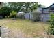 Backyard with fence, trees, and grass, providing a private outdoor area at 3154 Stonecastle Rd, Orlando, FL 32822