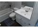 Bathroom featuring tub, toilet, white vanity, and a dark rug over tile floors at 3154 Stonecastle Rd, Orlando, FL 32822