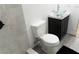 This renovated bathroom features gray-tiled walls, a hexagon-tiled shower floor, and a modern glass vessel sink at 3154 Stonecastle Rd, Orlando, FL 32822