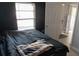 Bedroom with dark accent wall and a view to an open door and hallway at 3154 Stonecastle Rd, Orlando, FL 32822